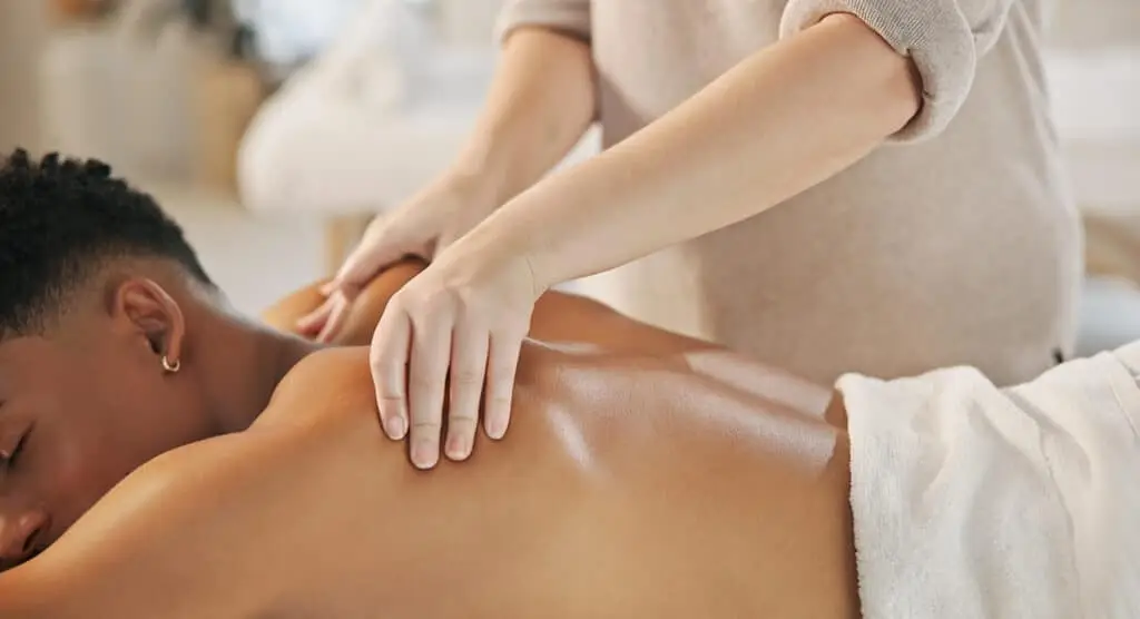 a person receiving a back massage